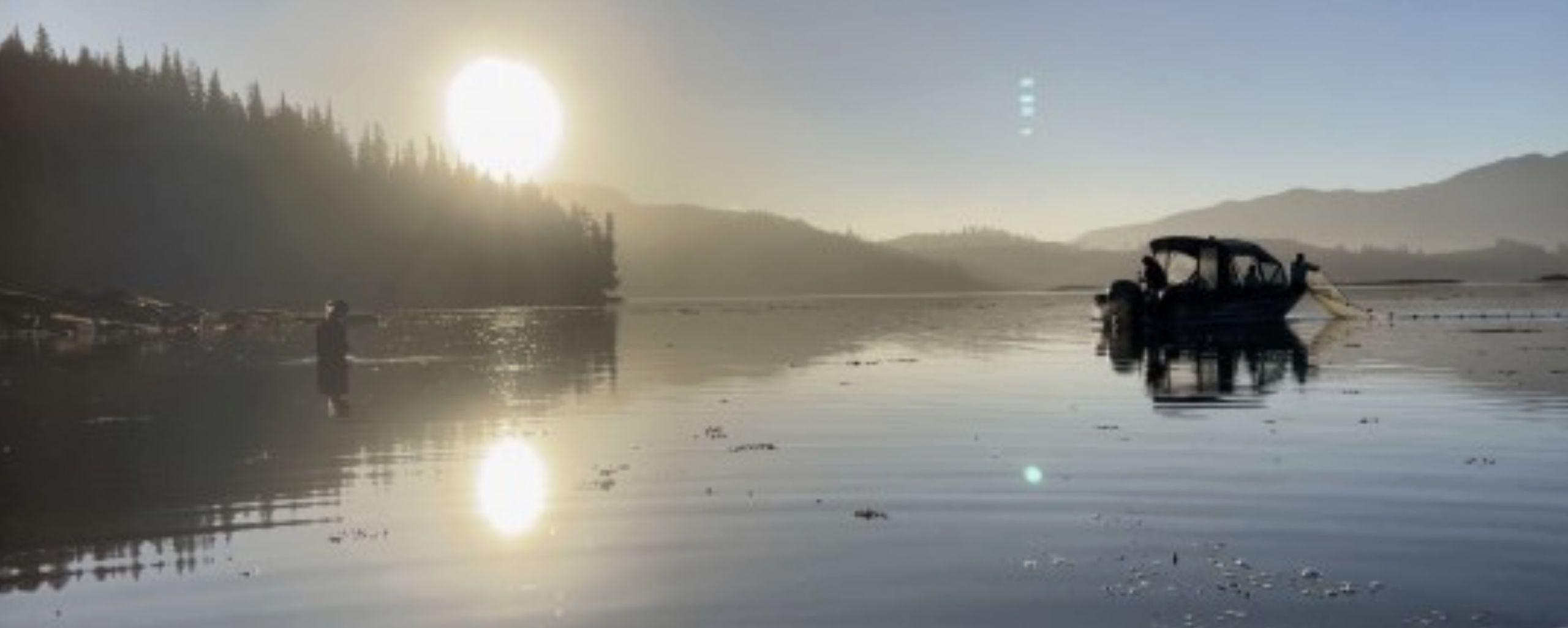  APECS Lab 2022 Field Team setting a beach seine net from a boat in Southeast Alaska.