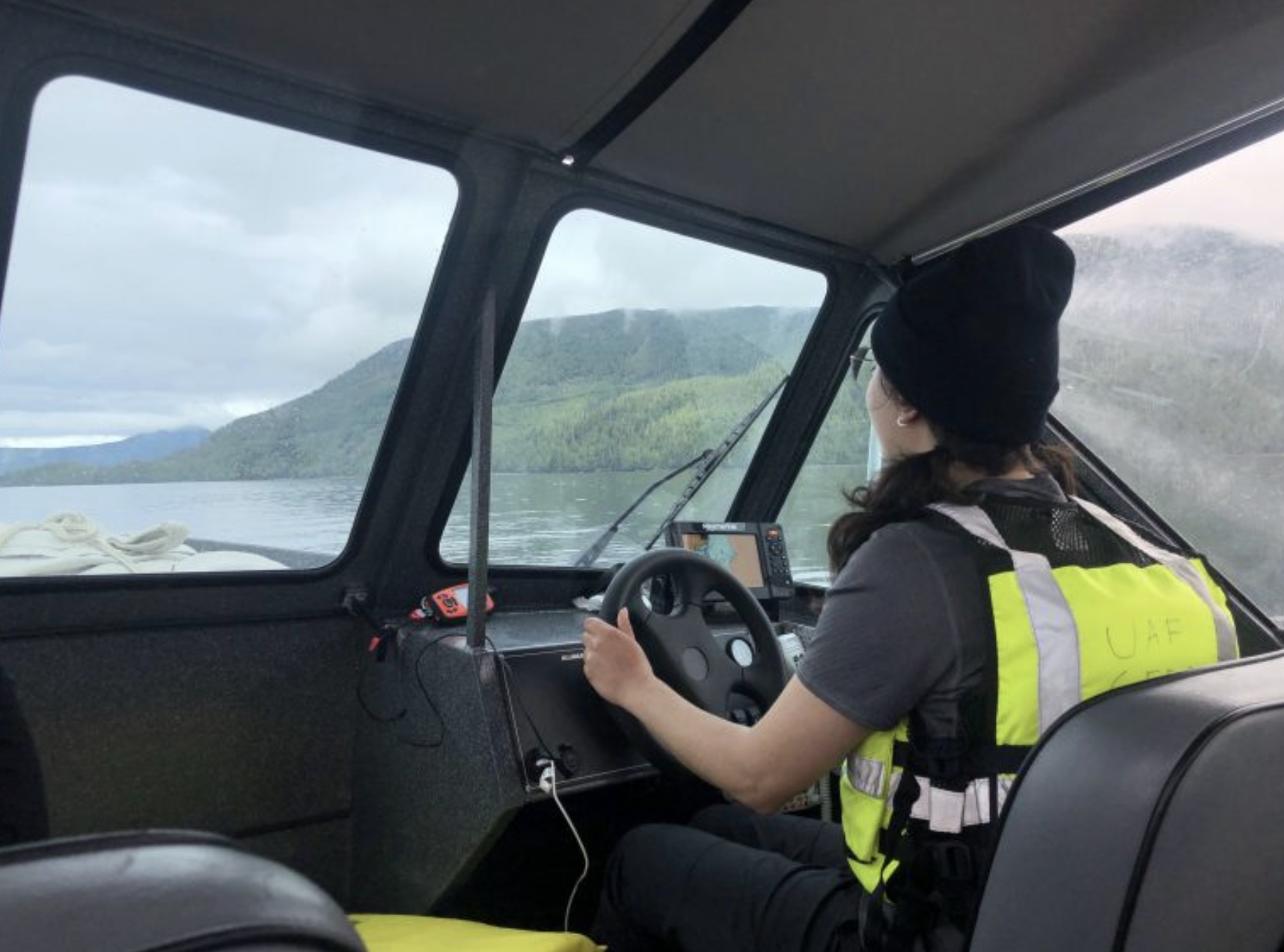 ElyseKelsey_SoutheastAlaska Elyse driving a boat to a sampling site in Southeast Alaska<br />